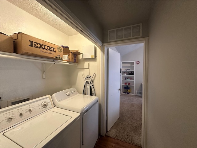 washroom with laundry area, visible vents, dark colored carpet, and independent washer and dryer