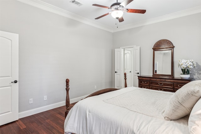 bedroom featuring a ceiling fan, wood finished floors, visible vents, baseboards, and crown molding