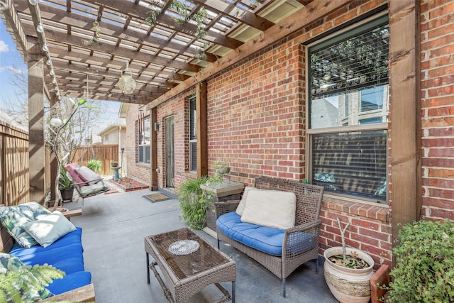 view of patio / terrace with an outdoor hangout area, a pergola, and fence