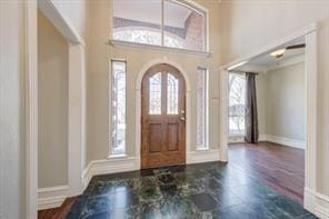 foyer entrance with baseboards