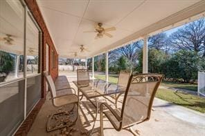 sunroom / solarium with plenty of natural light and a ceiling fan