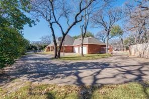 view of road featuring driveway