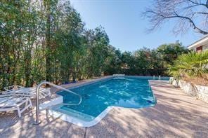 pool featuring a patio area