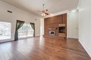 unfurnished living room with a fireplace, wood finished floors, a ceiling fan, and crown molding