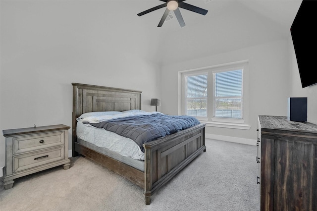 bedroom with light carpet, baseboards, and a ceiling fan