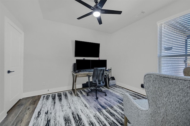 office featuring visible vents, ceiling fan, baseboards, and wood finished floors