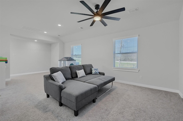 carpeted living room with recessed lighting, visible vents, and baseboards