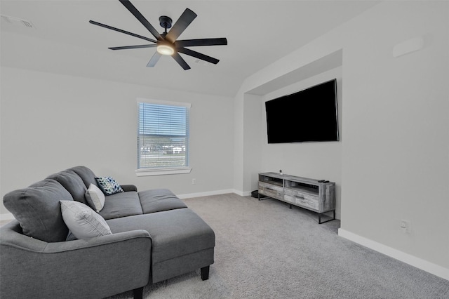 living room with ceiling fan, visible vents, baseboards, vaulted ceiling, and carpet