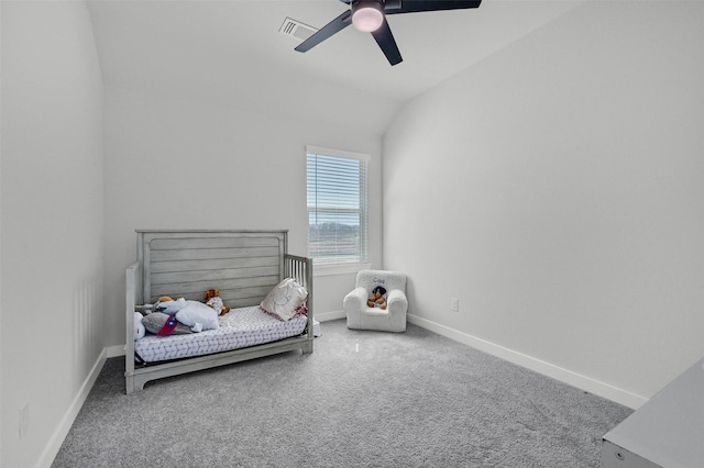 bedroom featuring ceiling fan, lofted ceiling, carpet flooring, visible vents, and baseboards