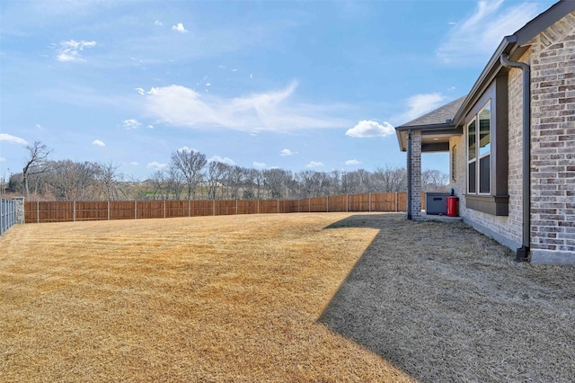 view of yard with a fenced backyard