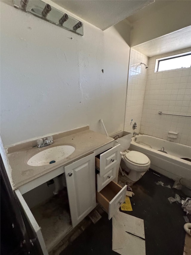 full bath with shower / bathtub combination, vanity, and toilet