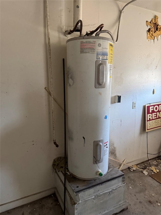 utility room featuring electric water heater