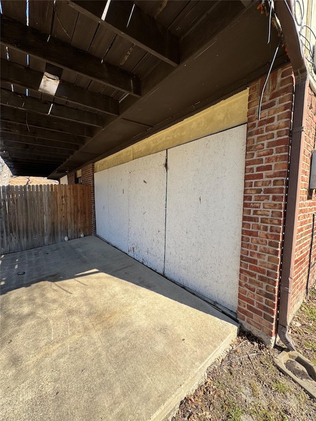 garage with fence