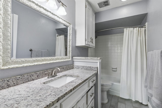 full bathroom with toilet, visible vents, shower / bath combo with shower curtain, and vanity