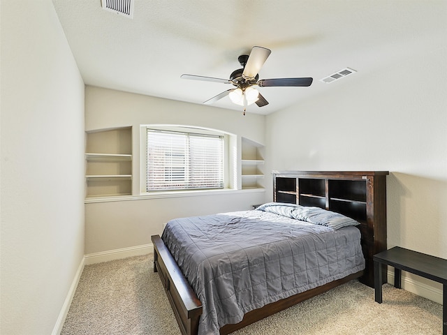 bedroom featuring a ceiling fan, carpet, visible vents, and baseboards