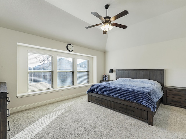 bedroom with lofted ceiling, baseboards, carpet floors, and a ceiling fan