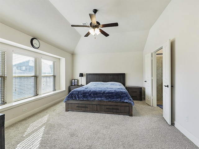 carpeted bedroom featuring lofted ceiling, ceiling fan, and baseboards