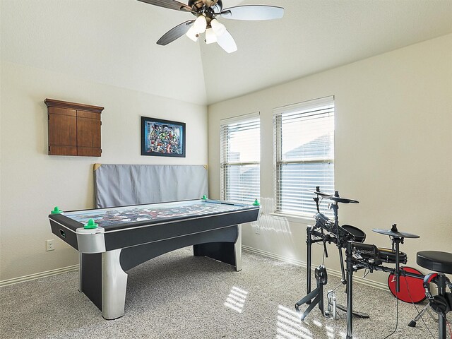 playroom with vaulted ceiling, baseboards, and ceiling fan