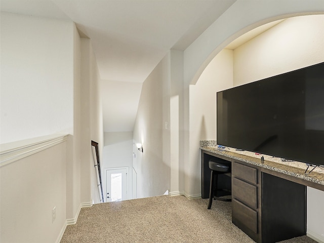 interior space with carpet floors and baseboards