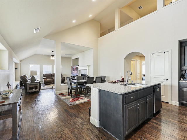 kitchen featuring dark wood-style floors, ceiling fan, visible vents, and a sink