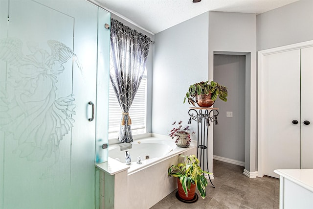 full bath with an enclosed shower, a jetted tub, baseboards, and a textured ceiling