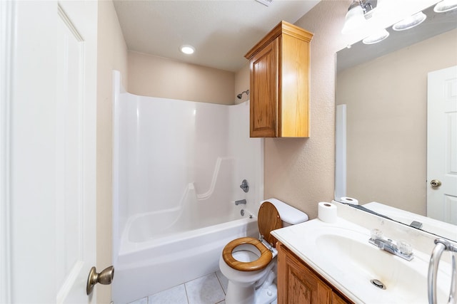 bathroom with shower / washtub combination, vanity, toilet, and tile patterned floors