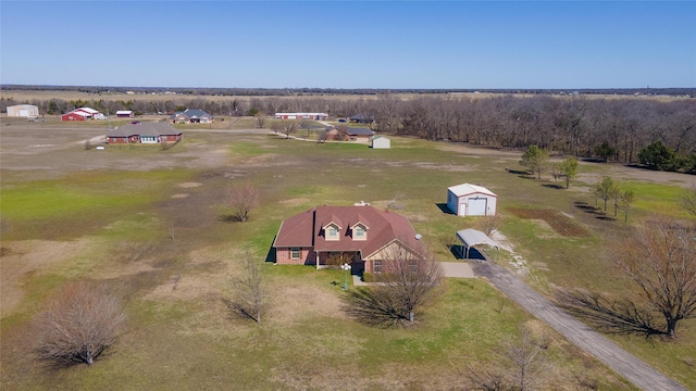 birds eye view of property featuring a rural view