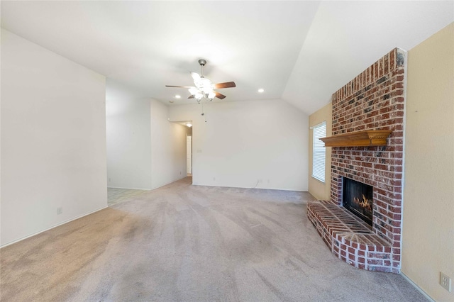 unfurnished living room with carpet, recessed lighting, a ceiling fan, a brick fireplace, and vaulted ceiling