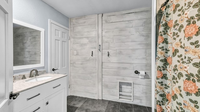 full bathroom with a shower with shower curtain and vanity