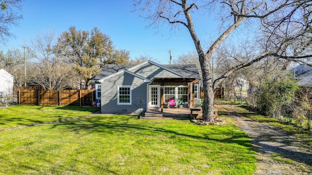 back of house with a deck, a yard, a fenced backyard, and a pergola