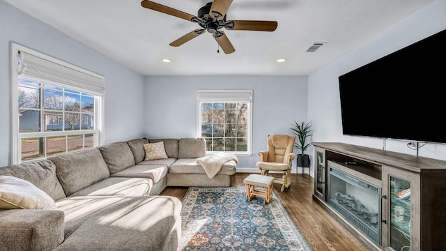 living area with recessed lighting, visible vents, wood finished floors, and a ceiling fan