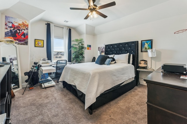 bedroom with lofted ceiling, light carpet, visible vents, and a ceiling fan