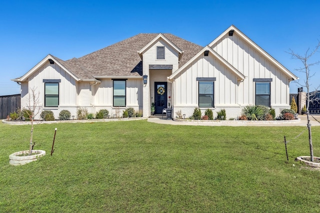 modern inspired farmhouse with a front lawn, board and batten siding, and roof with shingles