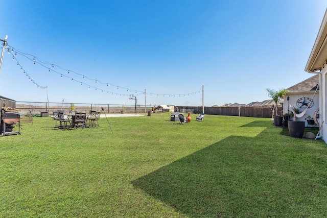 view of yard with a fenced backyard