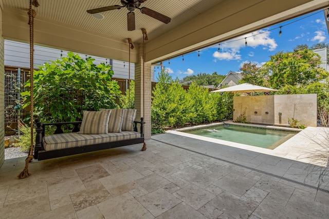 view of patio / terrace with a jacuzzi and ceiling fan