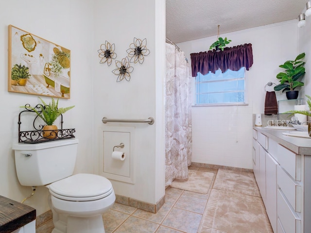 bathroom featuring curtained shower, toilet, a textured ceiling, vanity, and tile patterned flooring