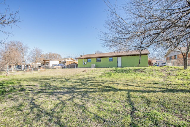 view of yard featuring fence and cooling unit