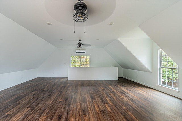 bonus room with lofted ceiling, baseboards, and dark wood-type flooring