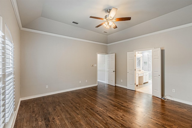 unfurnished room featuring baseboards, dark wood-type flooring, visible vents, and a ceiling fan