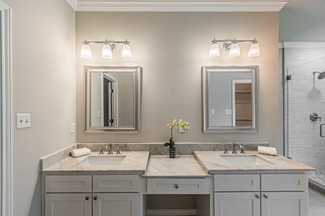 bathroom featuring double vanity, ornamental molding, a sink, and a shower stall