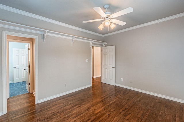 unfurnished bedroom featuring ornamental molding, dark wood-style flooring, ceiling fan, and baseboards