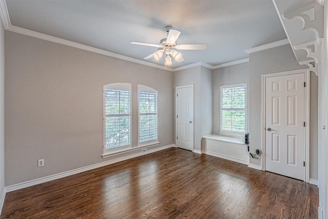 unfurnished room with dark wood-style flooring, a ceiling fan, and baseboards