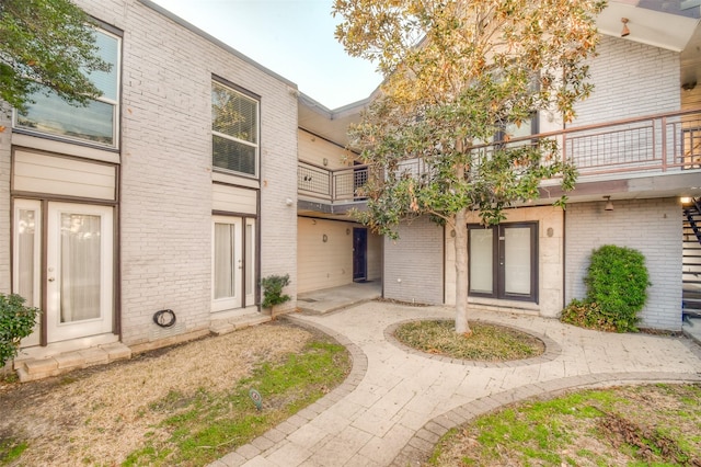 exterior space with brick siding