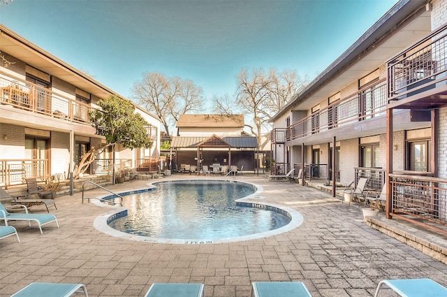 pool featuring a patio area