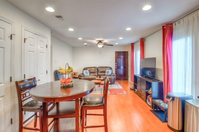 dining room featuring ceiling fan, light wood-type flooring, visible vents, and recessed lighting