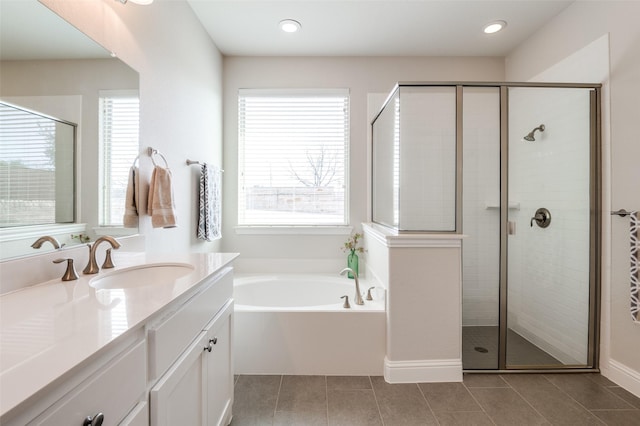 full bath with a shower stall, vanity, and tile patterned floors