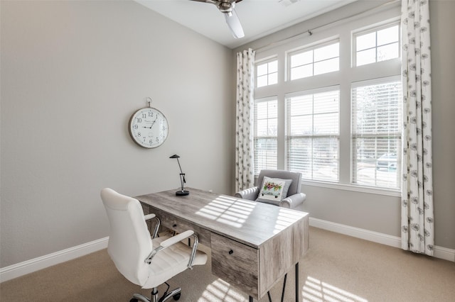 office with light carpet, ceiling fan, and baseboards