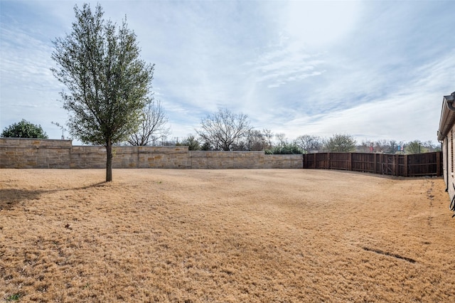 view of yard featuring fence