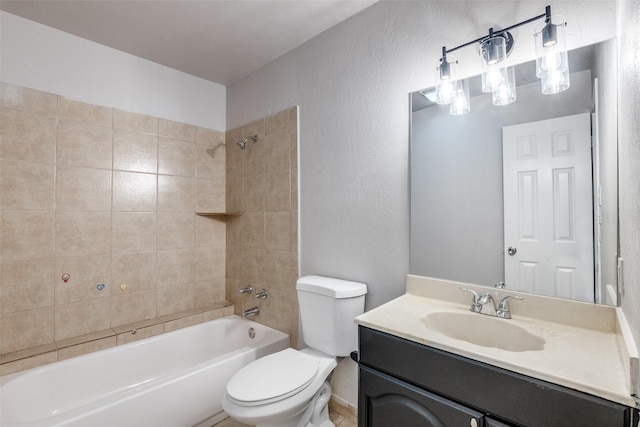 bathroom with shower / bathtub combination, a textured wall, vanity, and toilet