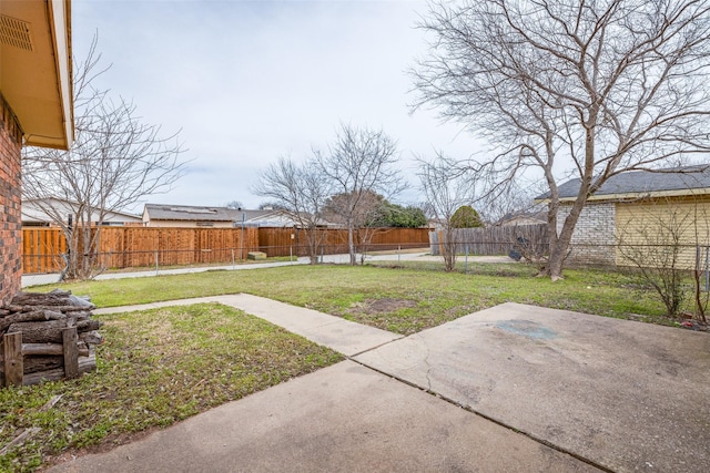 view of yard with a patio area and a fenced backyard